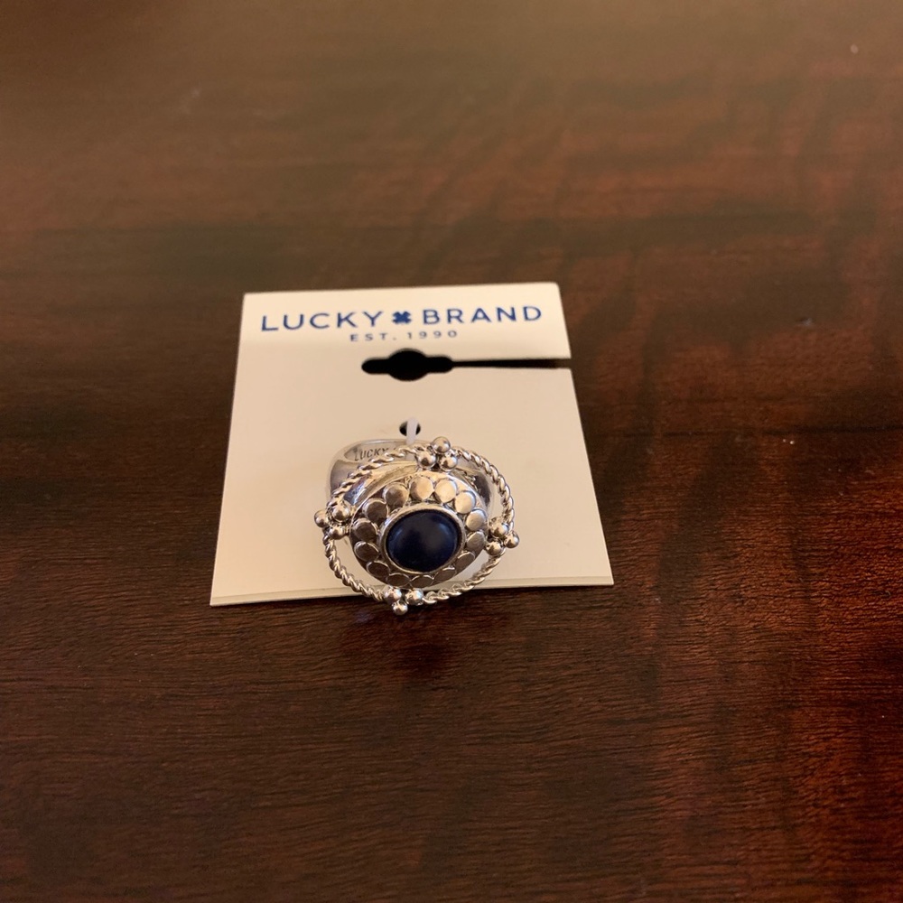 Lucky brand silver tone ring with blue stone